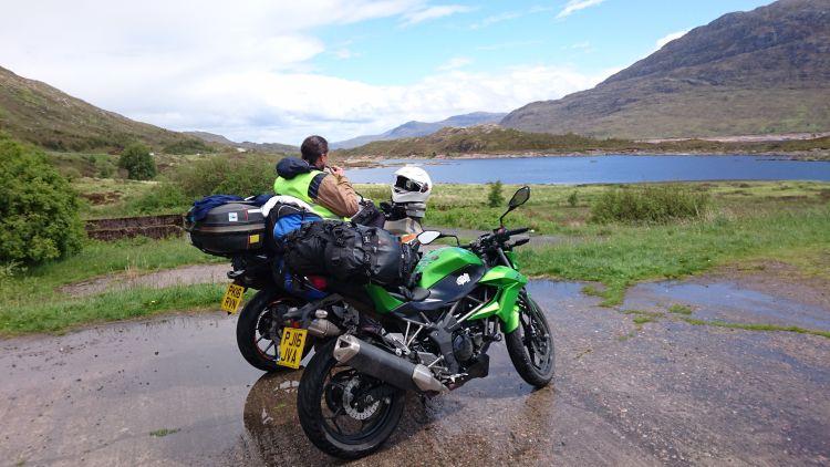 Ren sits on his bike overlooking the magnificence of Loch Duich 