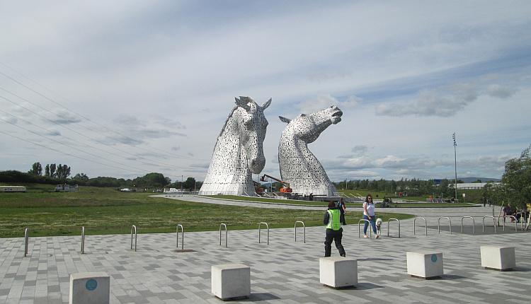 Sharon walks off to see the massive metal horse's heads at The Kelpies