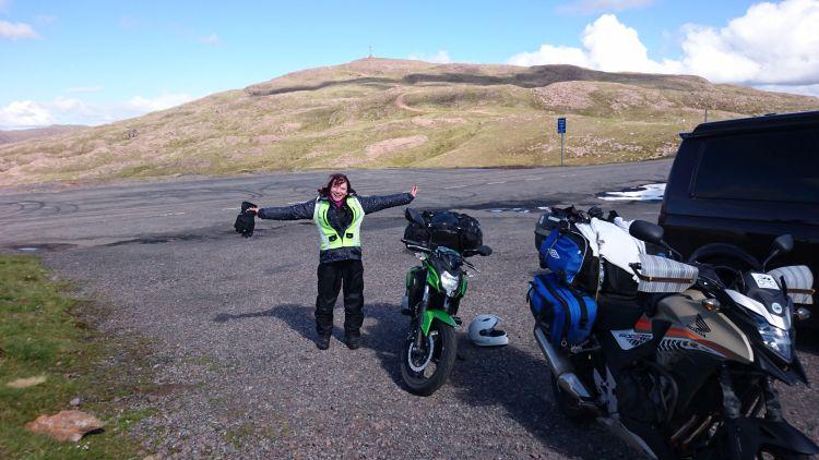 Sharon is jumping for joy having survived and conquered the Applecross Pass