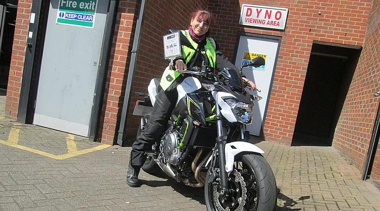 Sharon sits on Kawasaki's new Z650 and she can reach the floor. Big smile