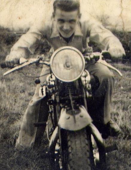 A very old image of Tom's dad grinning while looking dynamic upon a motorcycle of the day
