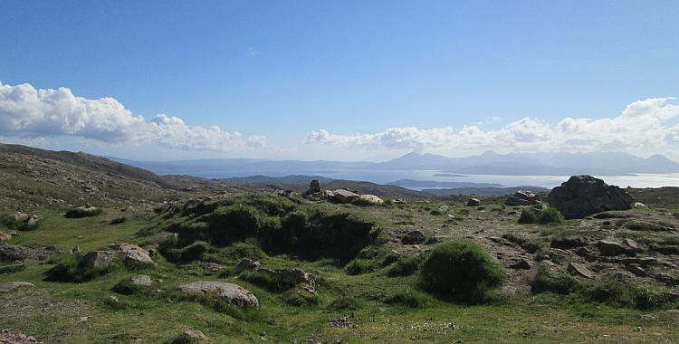 Hills, mountains, blue skies and distant rugged islands all seen from the Applecross pass