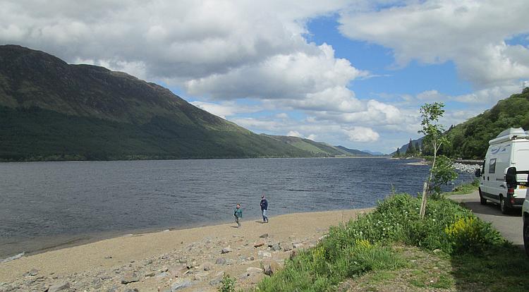 A highland loch with mountains, a beach and amazing scenery