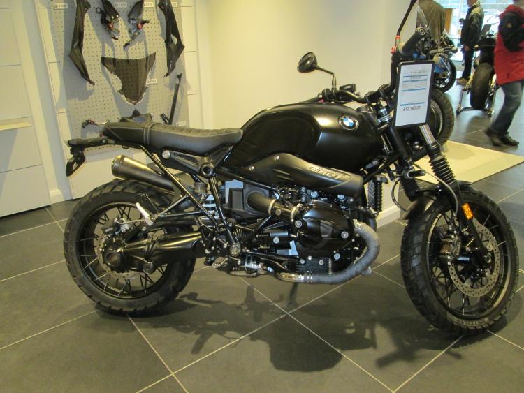 The BMW r nine t in black with wire wheels