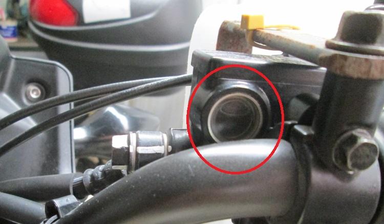 The sight glass on the master cylinder is circled in red