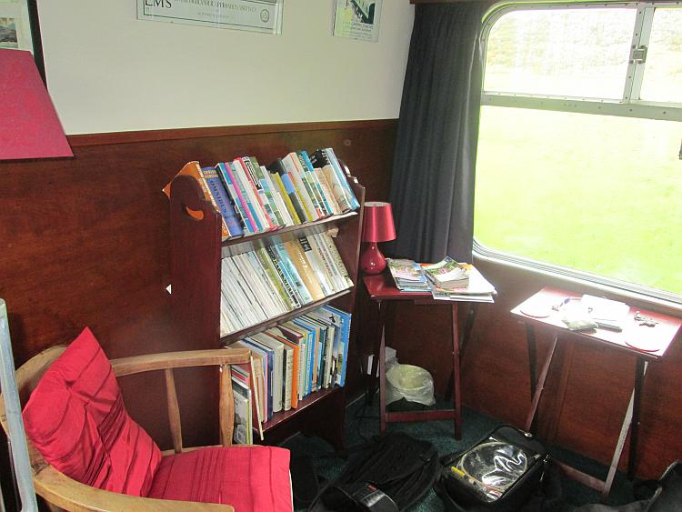 A little room that was once a cabin within the carriage is now a tiny sitting room