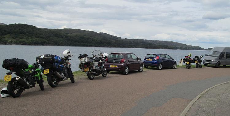 The motorcycles are at the roadside next to the Loch at Sheildaig. The skies are darker now