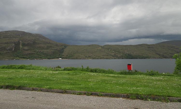 Dark heavy clouds forming over the hills around Ullapool and over Loch Broom