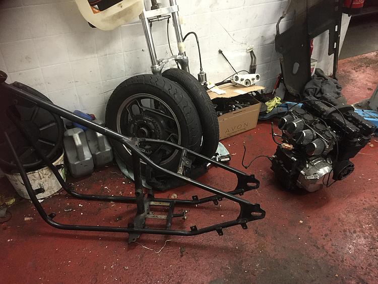 The frame, motoe, wheels and fork all stripped down in the workshop