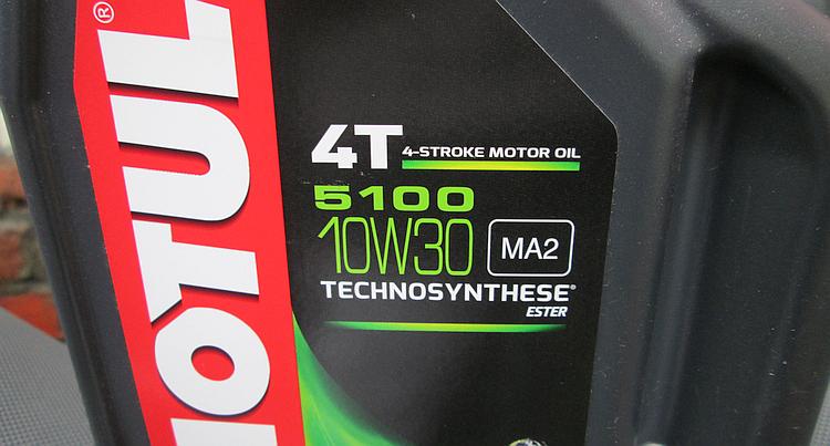A close up of the 10W-30 and specifications of the motul oil container