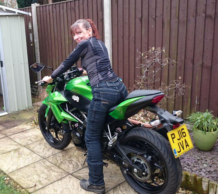 This time we see Sharon's backside in her jeans while sat on the bike