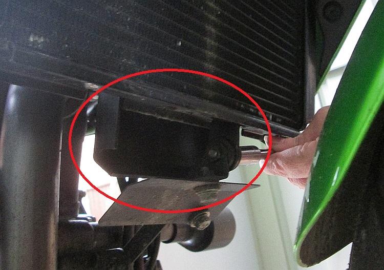 The cowl appears from behind the radiator, circled in red.