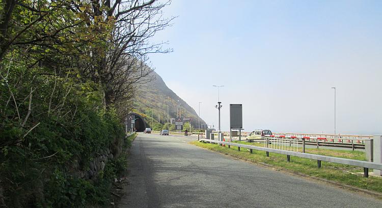 A hazy mist comes from the sea over the A55 and the entrance to a tunnel