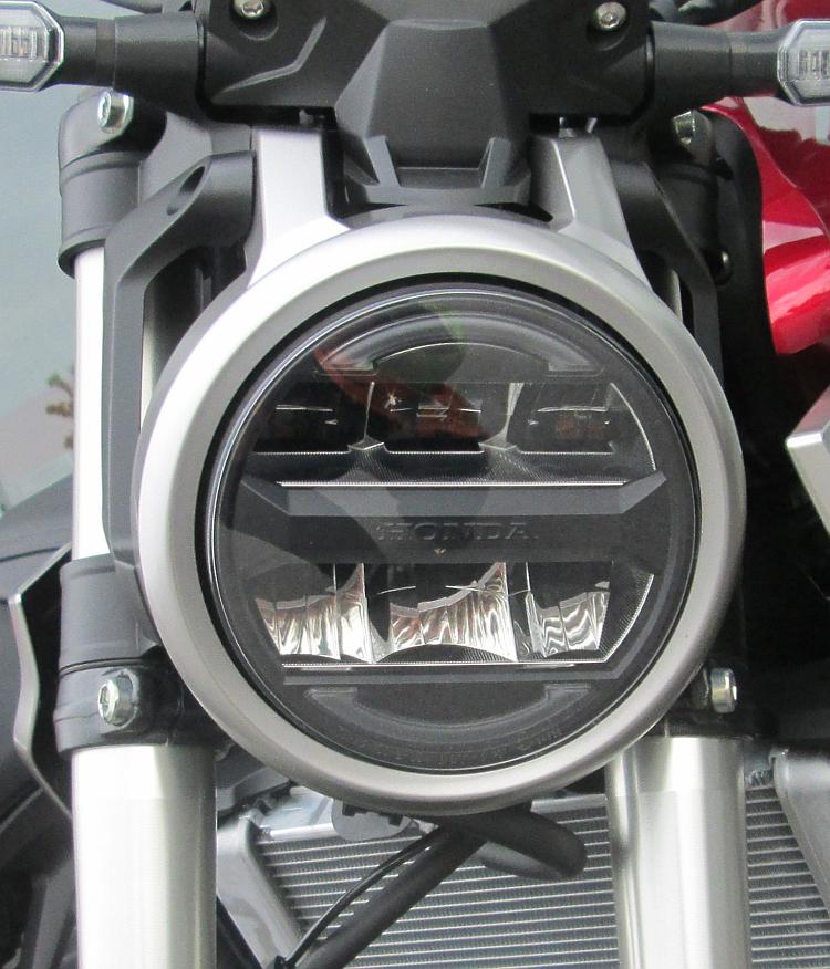 A round headlight case has rectangular LED pods within it