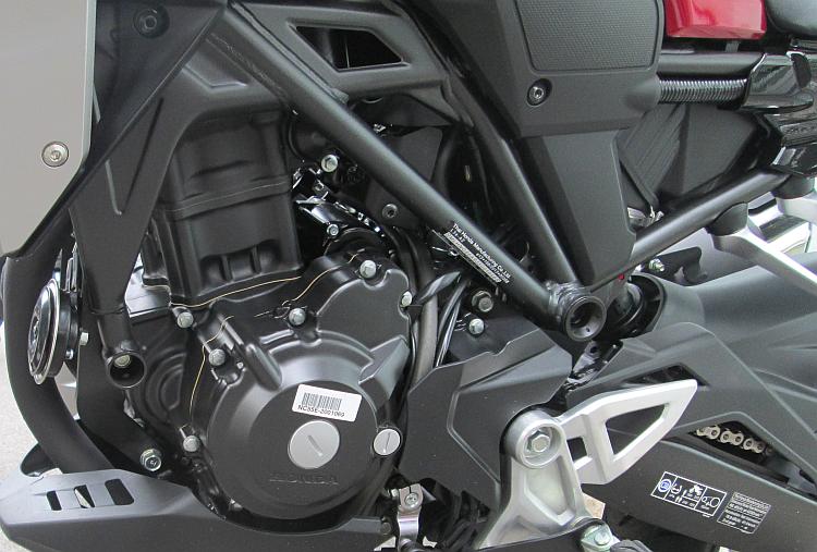 The black engine within the frame of the CB300R from Honda