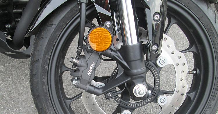 The Nissin front brake is radially mounted on the upside down forks
