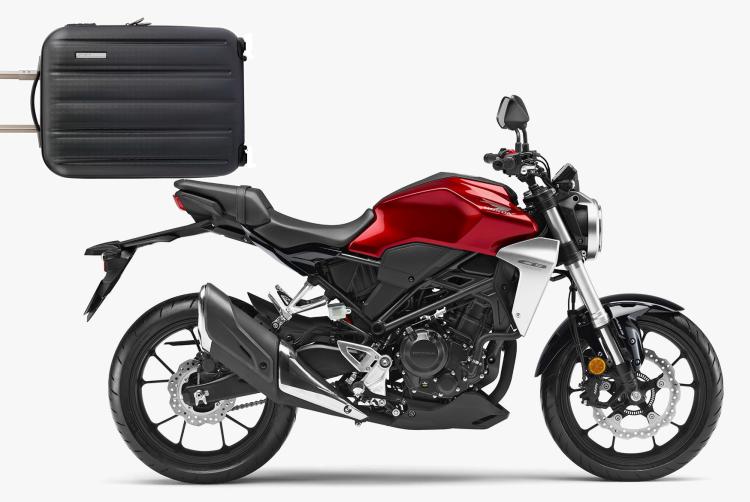A shot of the CB300R with a suitcase superimposed on the rear seat