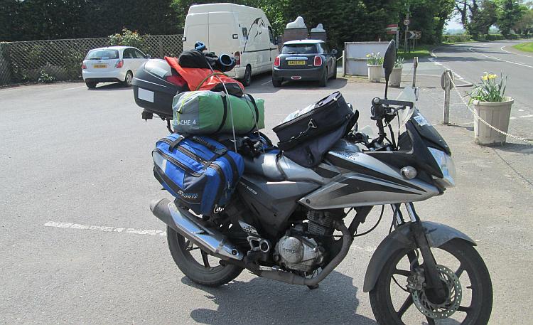 Ren's CBF125 Honda covered in luggage on the way to Anglesey