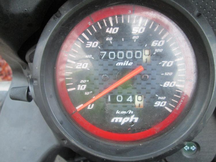 The speedometer shows 70000 miles on the CBF 125