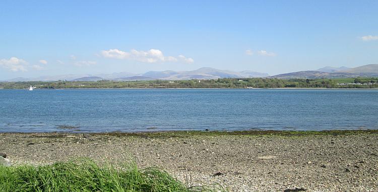 Looking across the Menai Strait we see the majestic Welsh hills and mountains in the sun