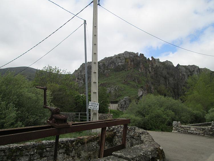 Hard angular rocky outcrop with an ugly concrete telegraph pole in the foreground
