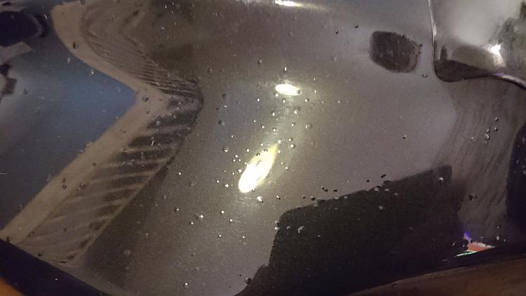 There are small blisters or bubbles on the petrol tank