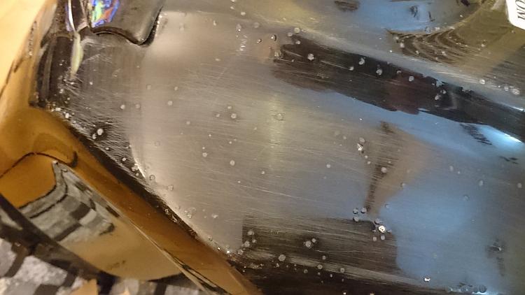 More scratches from sanding the tank with the flattened off blisters in view