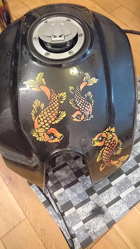 3 koi fish are starting to form in paint on the petrol tank now