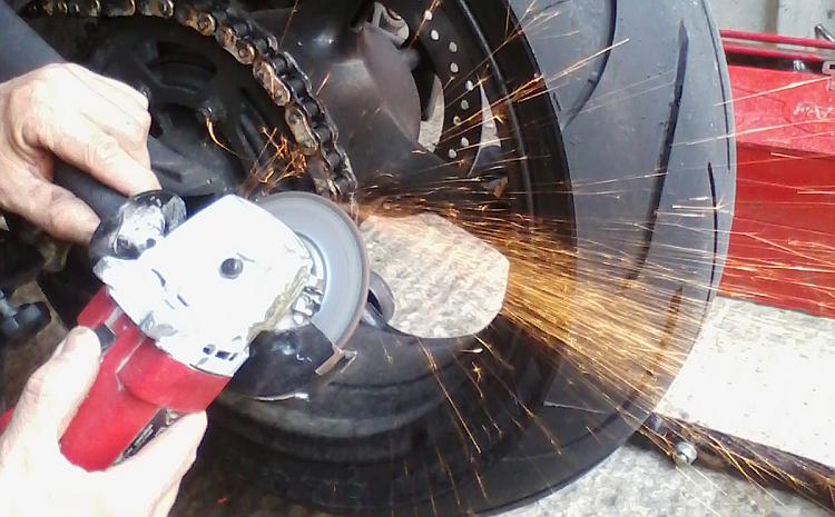 An angle grinder used to grind off an old motorcycle chain