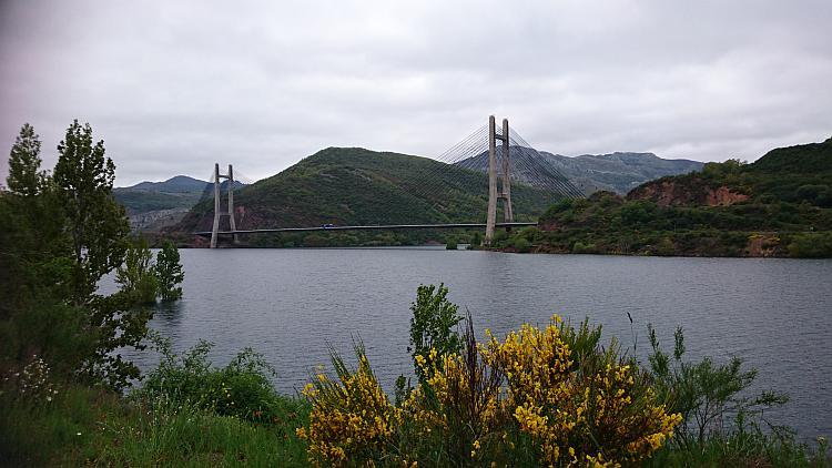 A large suspension bridge over a reservoir, Embalse de los barrios de luna