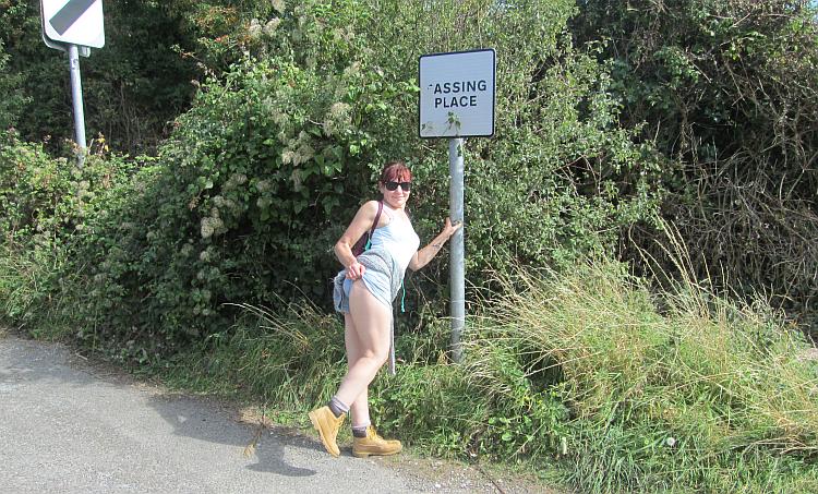 A signs says "assing place" so sharon shows us a bit of her bottom