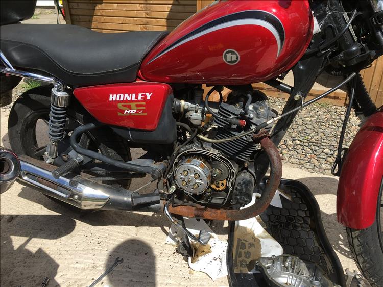 The Honley 125 with the clutch cover off showing the inside of the motor