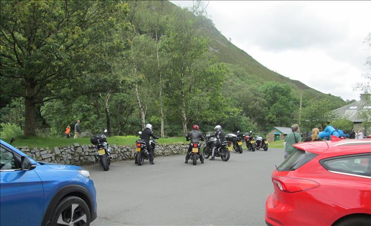 A handful of riders parking the bikes at the Elan Valley Vistor Centre car park