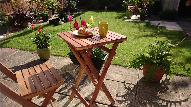 A lawn, lost of flowers and plane, breakfast outside and sunshine all in Sharon's little garden