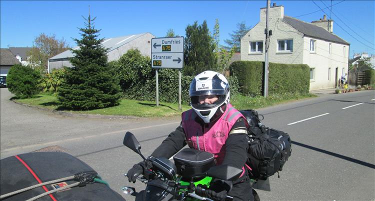Sharon astride her loaded Z250SL ready to ride the A712
