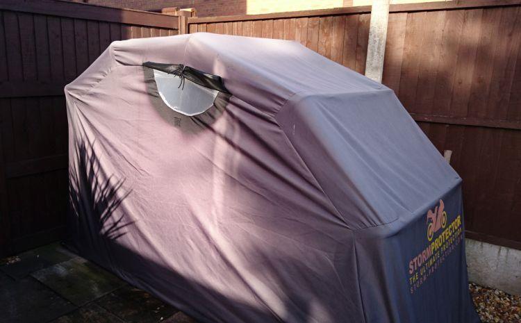 A cloth and metal tube "StormProtector" motorcycle shelter