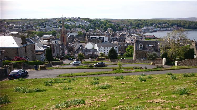 A wide shot of the serpentine road snaking down into the quite large town of Rothesay