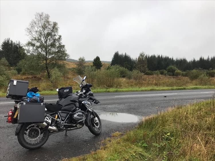The big BMW GS1200 among the moors and trees of the Galloway Forest Park