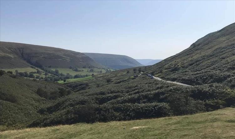 Rolling hills, valleys, a narrow winding road and glorious sunshine in Wales