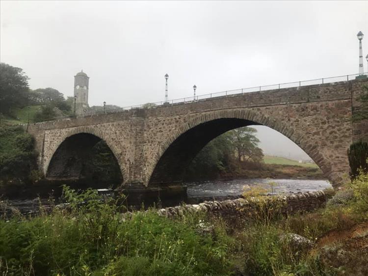 A stone arched bridge with 2 spans in the town of Helmsdale East scotland