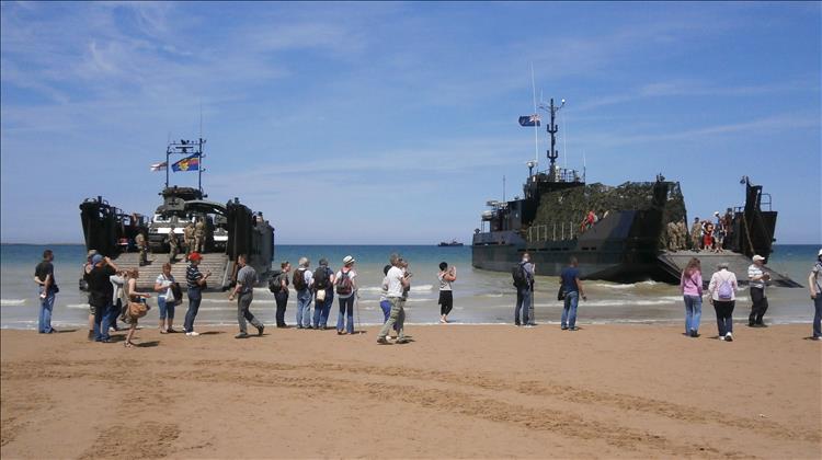 Large modern landing craft on the Normandy beaches remembering the D-Day landings