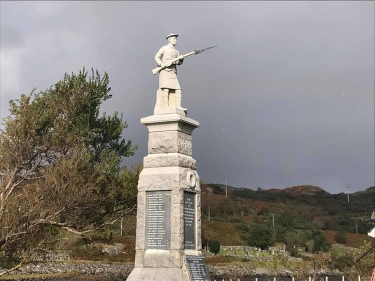A tall plinth with stone soldier, the war memorial at Lochinver
