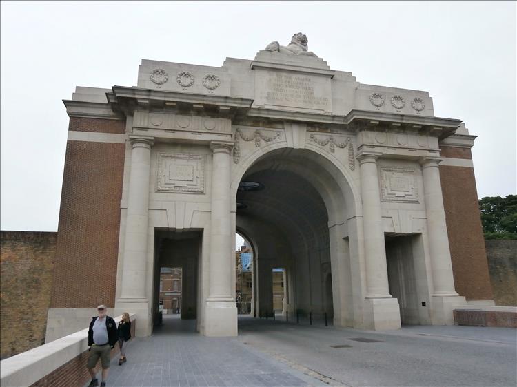 The Menin Gate at Ypres. A large ornate brick and stone memorial to soldiers of the wars