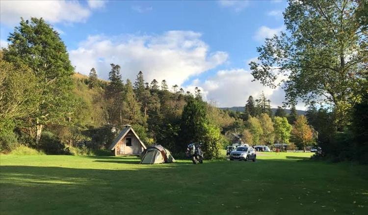 The campsite with Andy's tent, a pod and lots of trees at Strontian