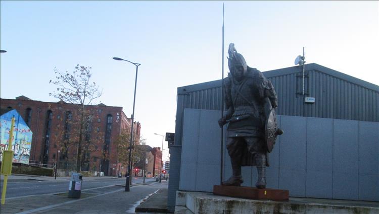 A large bronze statue of a saxon located in Liverpool's Baltic Triangle