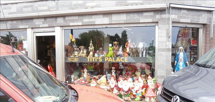 A simple shop window with "Titi's Palace" sign. It appears to sell, amongst other things, gnomes