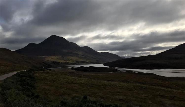 Dark skies and dark ominous mountains as the weather closes in on the Summer Isles