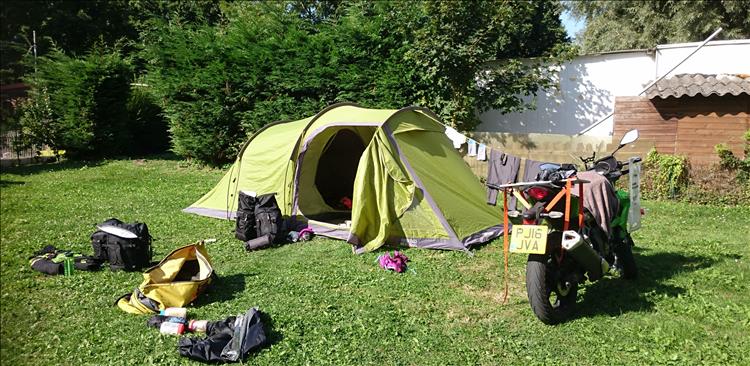 The tent, Sharon's bike, washing dring on a bungee all bathed in warm sun