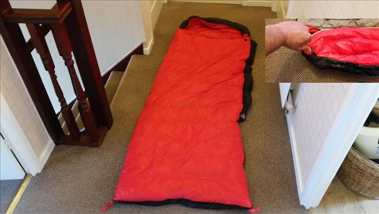 A bright red but rectangular sleeping bag with detachable hood