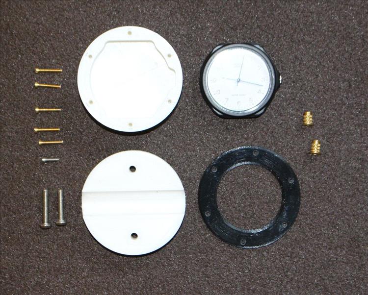 The parts, 3D printed body and bezel and a collection of smart brass screws and fixings